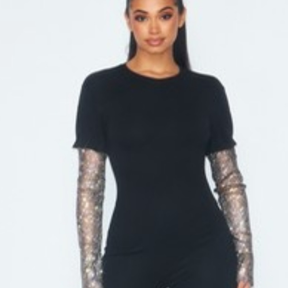 Black jumper with net material arms sparkling